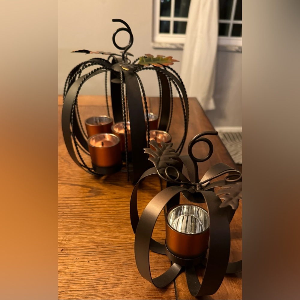 Set of 2 metal pumpkin candle holder designed for fall or Thanksgiving decor.